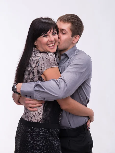 Man kissing his smiling girlfriend — Stock Photo, Image