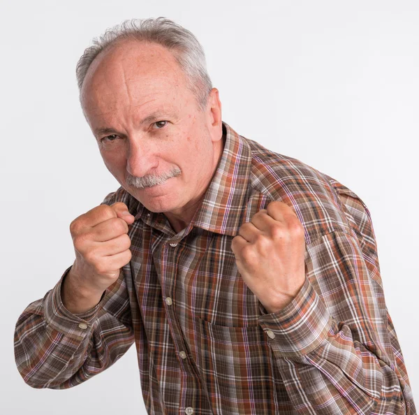 Mature man in boxer pose with raised fists — Stock Photo, Image