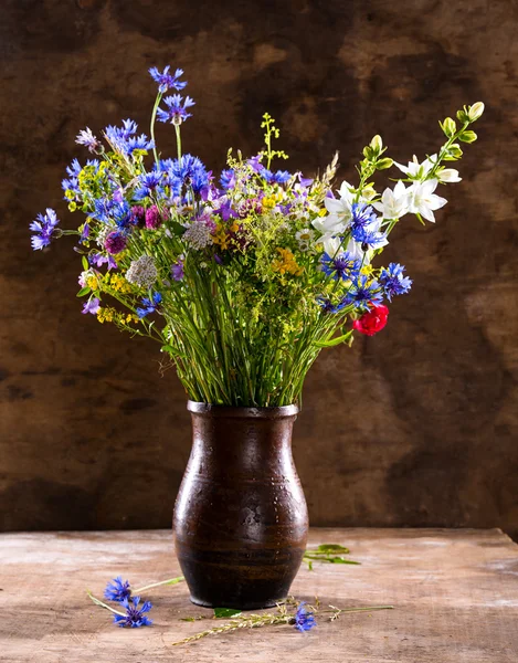 Beautiful bouquet of bright wildflowers in vase — Stock Photo, Image