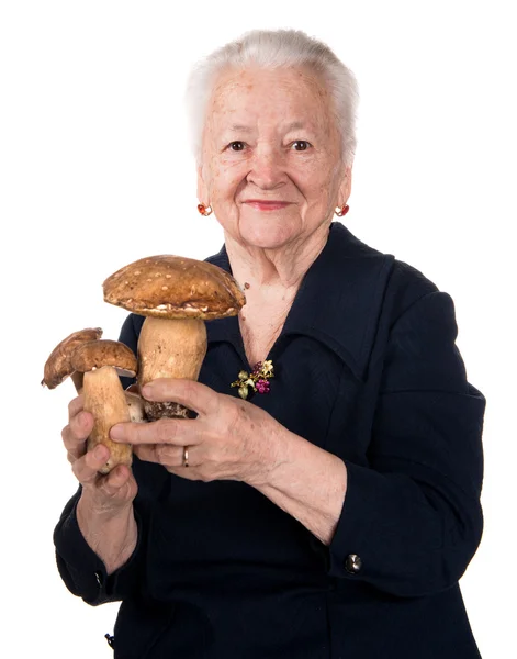 Stará žena s houbami v rukou — Stock fotografie