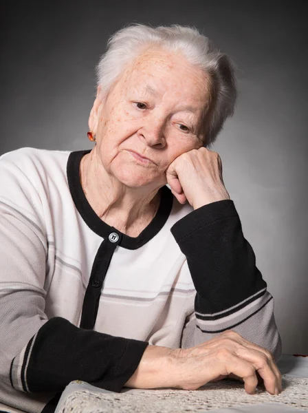 Old thoughtful woman — Stock Photo, Image