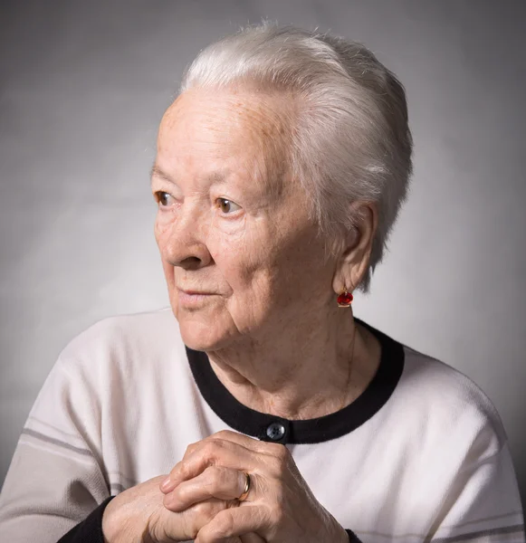 Old thoughtful woman — Stock Photo, Image