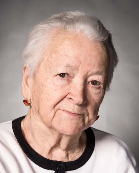 Old thoughtful woman — Stock Photo, Image