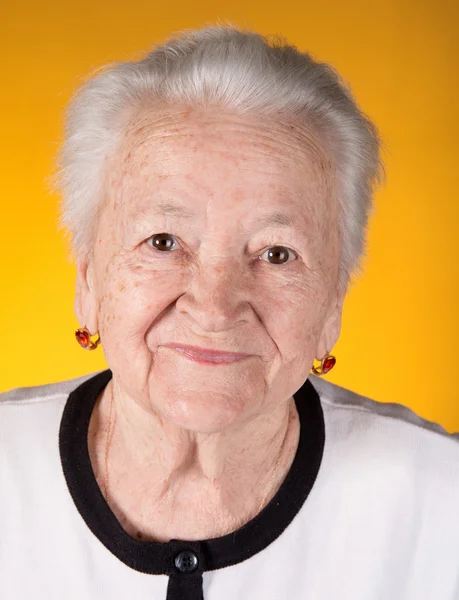 Portrait of smiling old woman — Stock Photo, Image