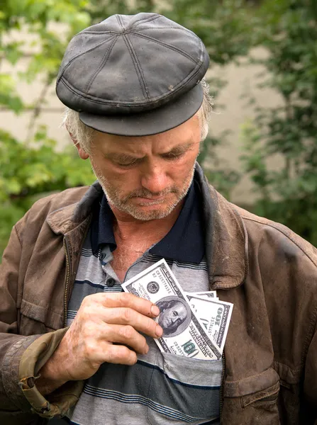 O agricultor com dinheiro no casaco — Fotografia de Stock