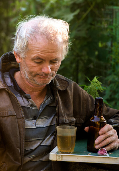 Drunk man sitting at the table