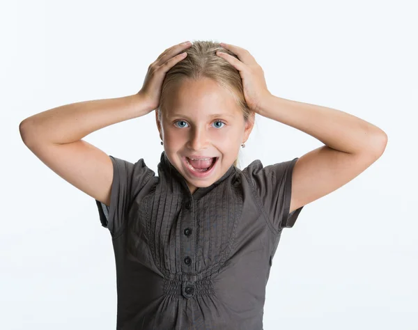 Surprised little girl kid with hands on her head — Stock Photo, Image