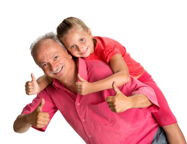 Portrait of a little girl enjoying piggyback ride with her grand — Stock Photo, Image