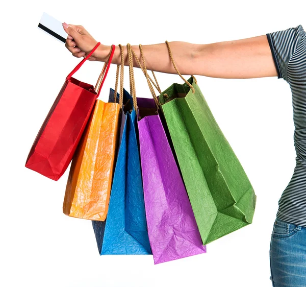 Vrouw hand met shopping tassen — Stockfoto