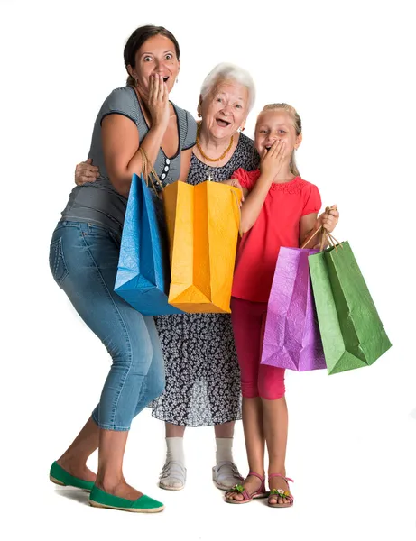 Tres generaciones de mujeres con bolsas de compras — Foto de Stock