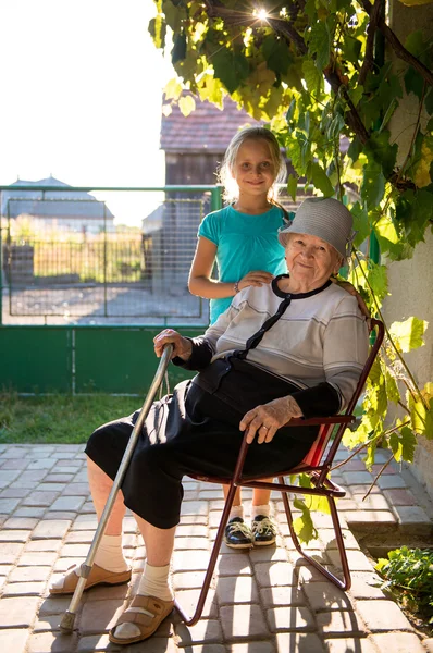 Smiling grandmother with granddaughter — Stok fotoğraf