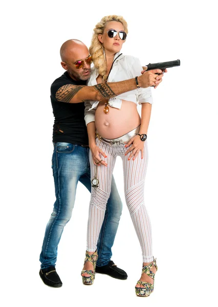 Man with a gun and pregnant woman — Stock Photo, Image