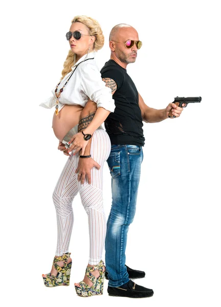 Man with a gun and pregnant woman — Stock Photo, Image