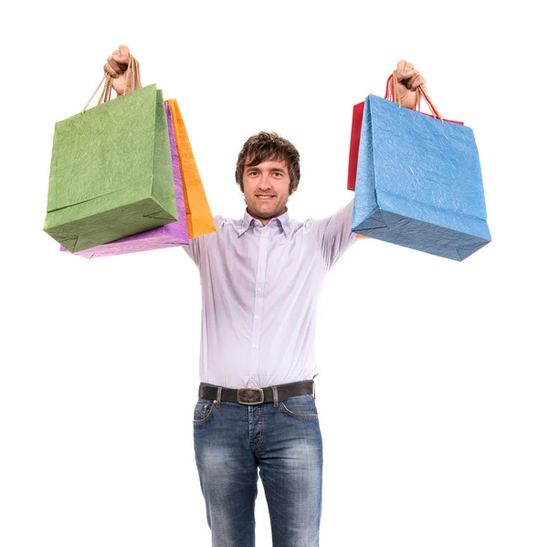 Homem bonito feliz com sacos de compras — Fotografia de Stock