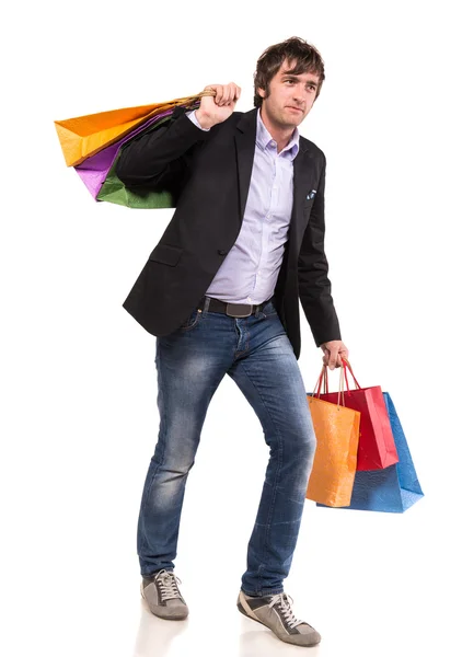 Homem bonito feliz com sacos de compras — Fotografia de Stock