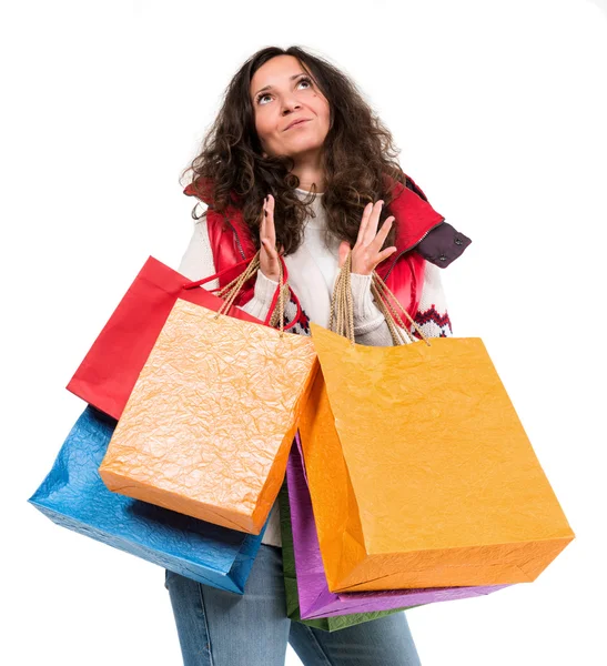 Mulher feliz em roupas quentes com sacos de compras — Fotografia de Stock