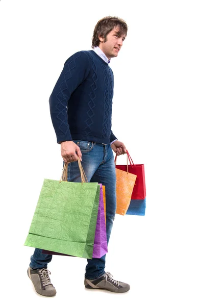 Glücklicher schöner Mann mit Einkaufstaschen — Stockfoto