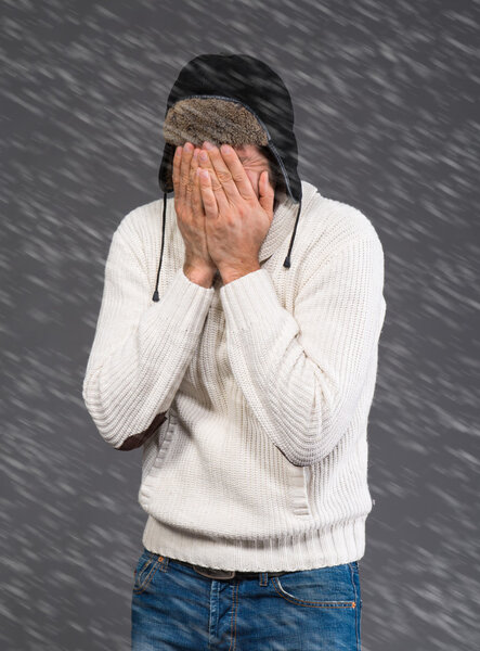 Handsome man in warm sweater and hat