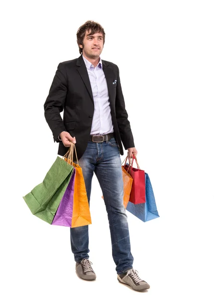 Bonito homem com sacos de compras — Fotografia de Stock