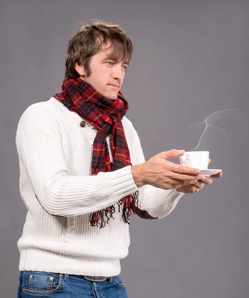 Man with cup of hot coffee or tea — Stock Photo, Image