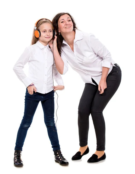 Little girl in headphones and her mother — Stock Photo, Image