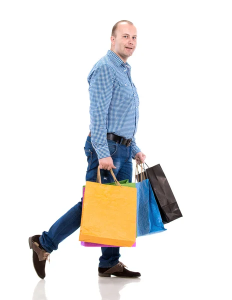 Bonito homem com sacos de compras — Fotografia de Stock