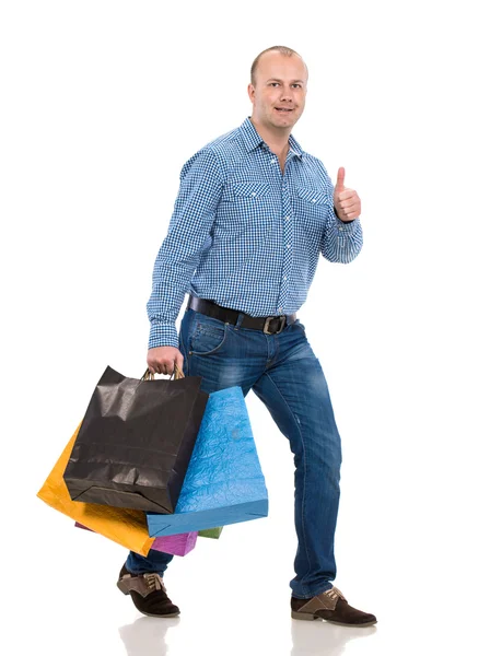 Bell'uomo con le borse della spesa — Foto Stock
