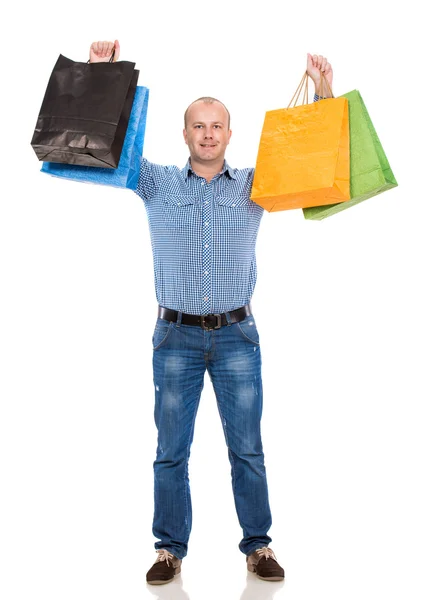 Bonito homem com sacos de compras — Fotografia de Stock