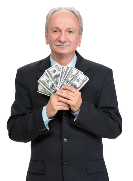 Senior Geschäftsmann hält Gruppe von Dollar — Stockfoto