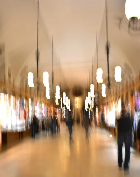 People silhouettes in shopping mall — Stock Photo, Image