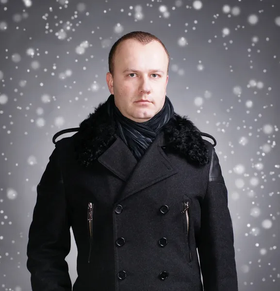 Young man in coat — Stock Photo, Image