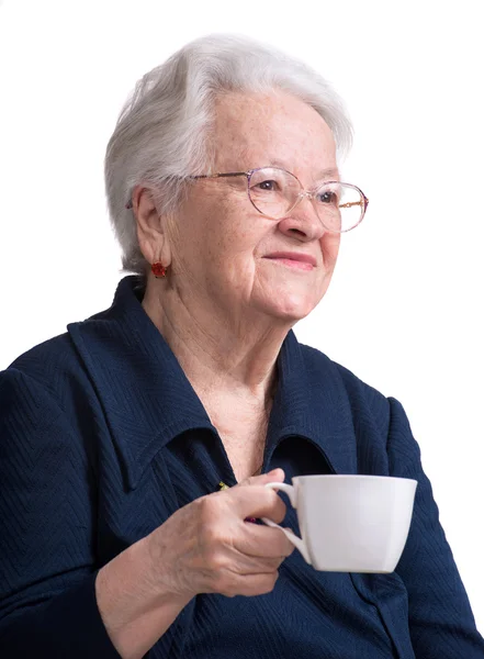 Old woman enjoying coffee or tea cup — Stock Photo, Image