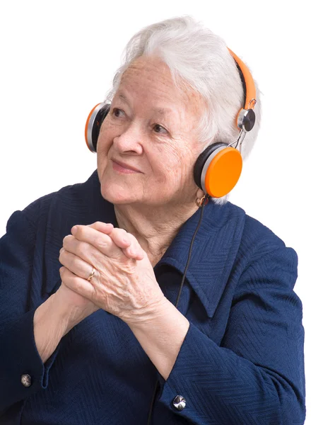 Anciana escuchando música en auriculares —  Fotos de Stock