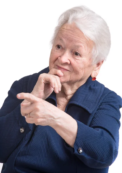 Retrato de uma velha mulher feliz apontando — Fotografia de Stock