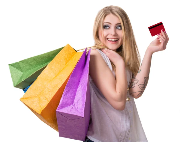 Gelukkig meisje met shopping tassen en credit card — Stockfoto