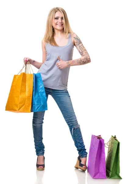 Šťastná dívka s nákupními taškami — Stock fotografie