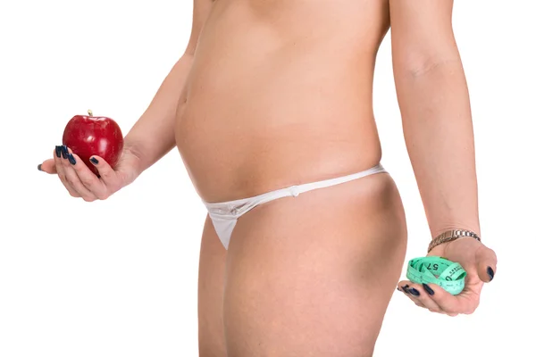 Frau hält Apfel und Zentimeter — Stockfoto