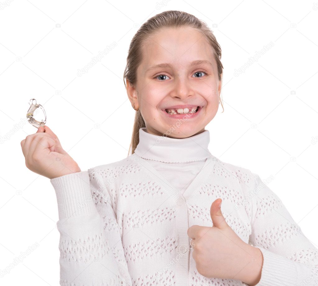 Girl holding dental braces