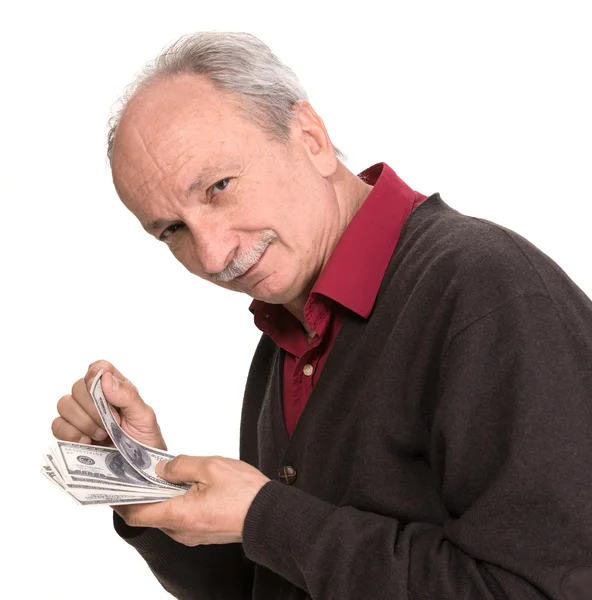 Senior man holding at dollar bills — Stock Photo, Image