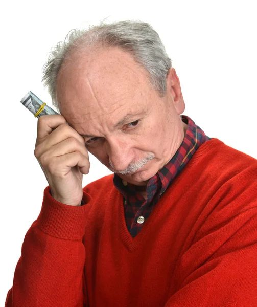 Elderly sad man with dollar bills — Stock Photo, Image