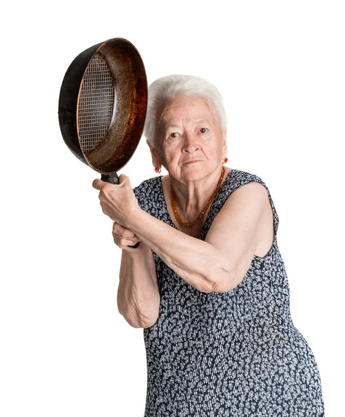 Angry old woman with a pan — Stock Photo, Image