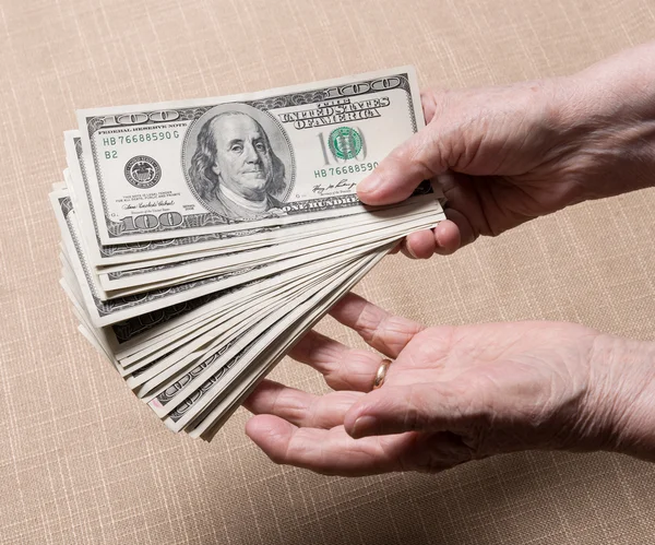 Woman's hands and dollar bills — Stock Photo, Image