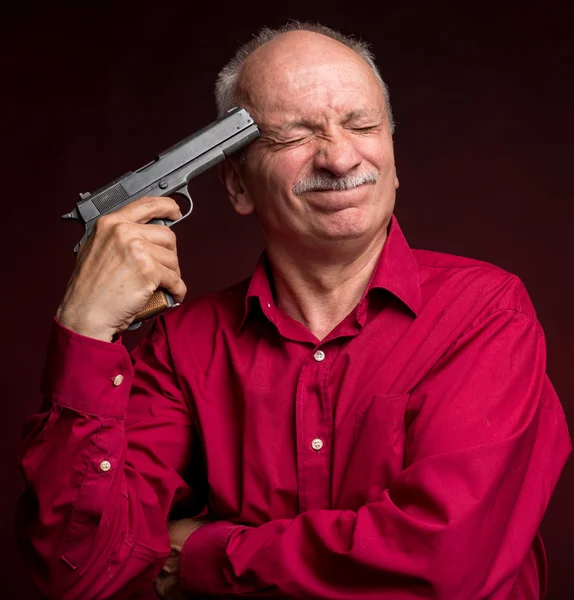 Man with gun wants to commit suicide — Stock Photo, Image