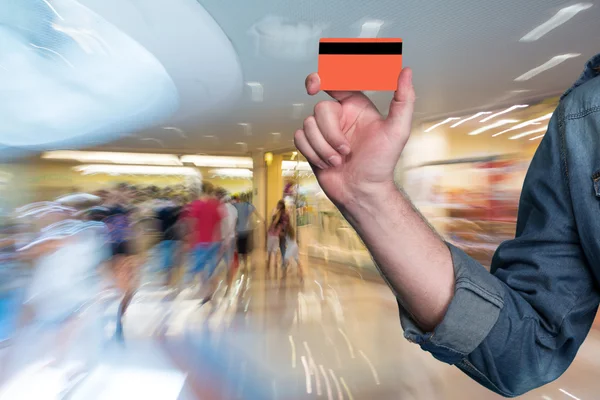 Man holding a credit card in his hand — Stock Photo, Image