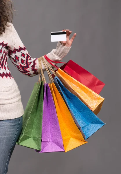 Female hand holding shopping bags — Stock Photo, Image
