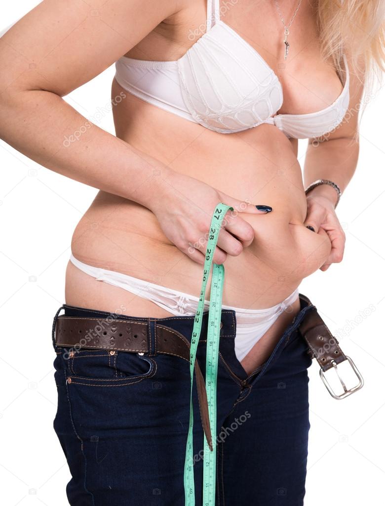Woman pinching her fat tummy
