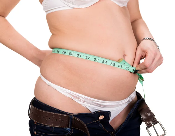 Overweight woman measuring waistline — Stock Photo, Image