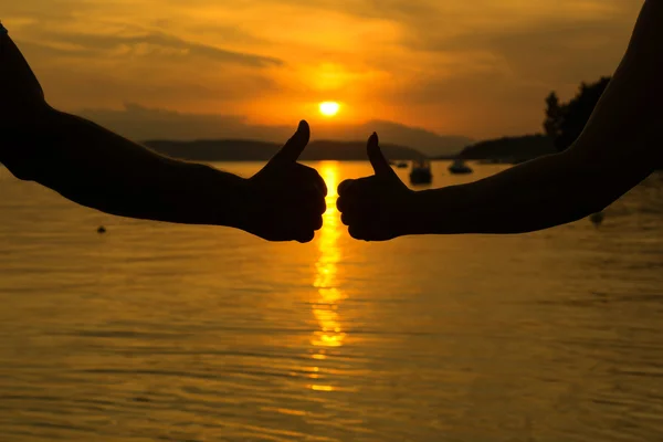 Man and woman showing thumbs up — Stock Photo, Image