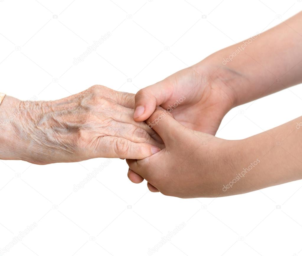 Old woman and young girl  holding hands