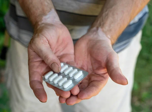 Man Holding Pile Pills Hands Outdoors — Photo